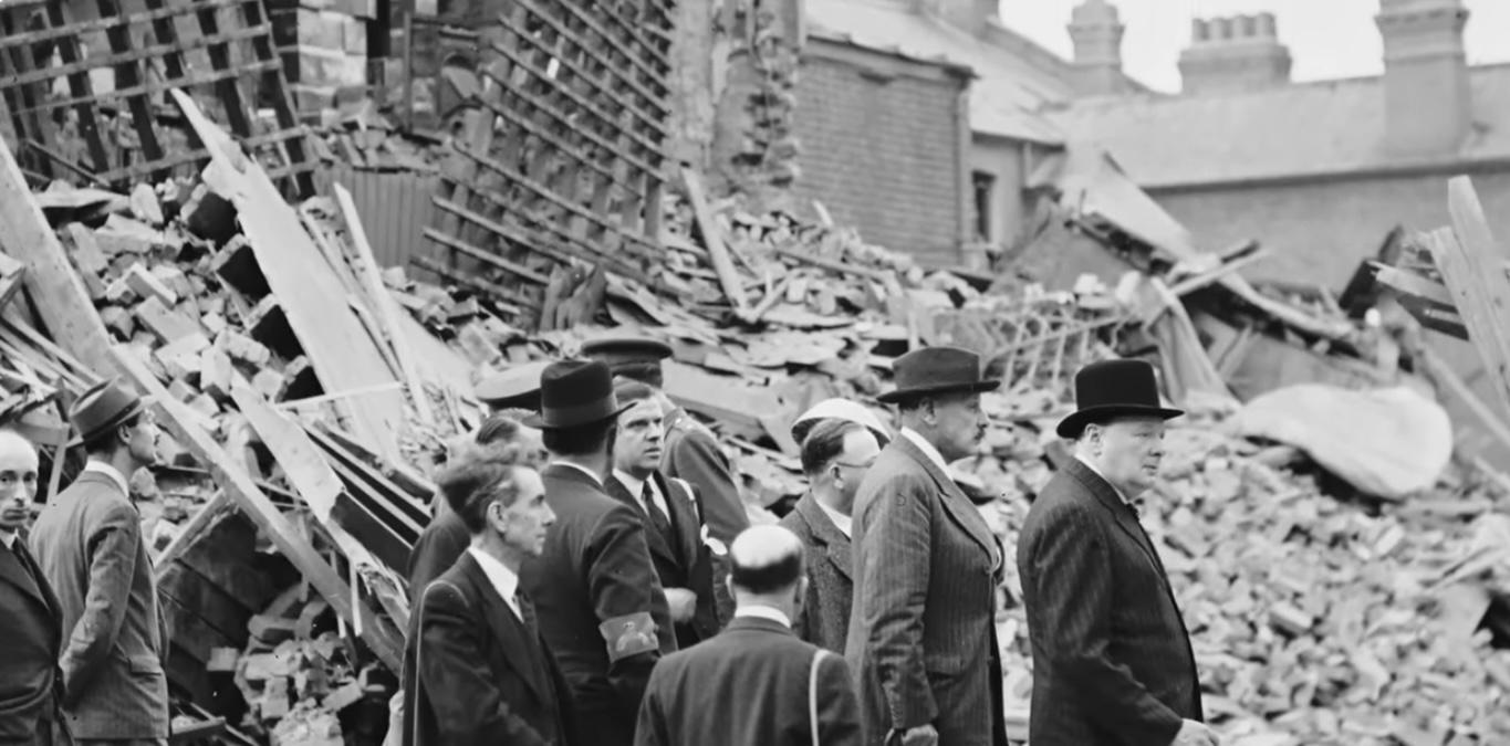 Winston Churchill examining bombing damage ww2 blitz bombing 