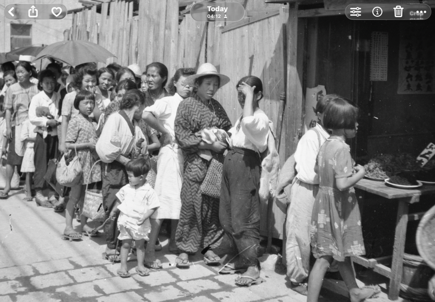 Japanese queuing for food rations 