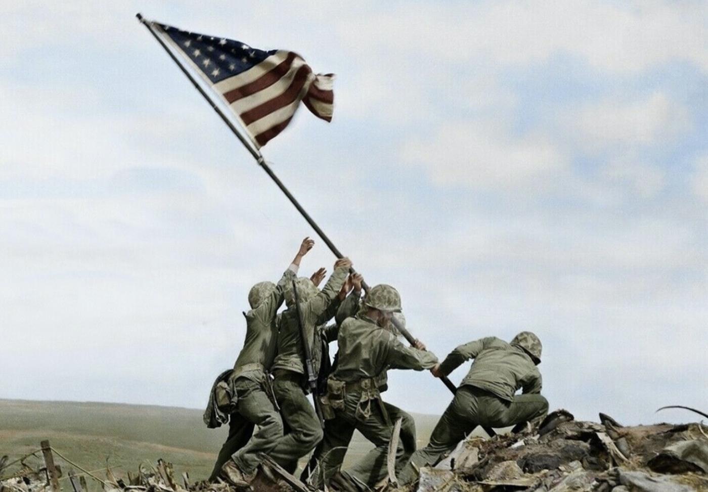 Us marines on Nima raising USA flag 