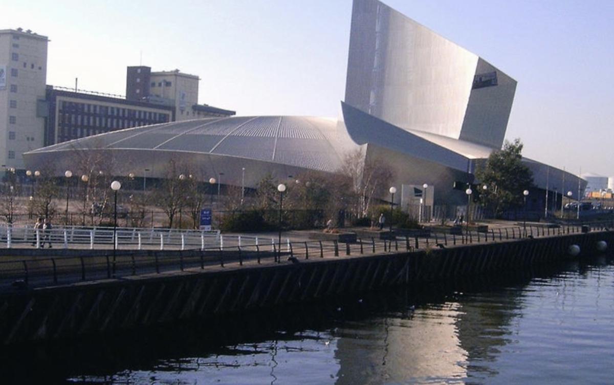 Modern striking building next to canal