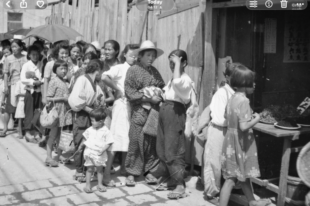 Japanese queuing for food rations 